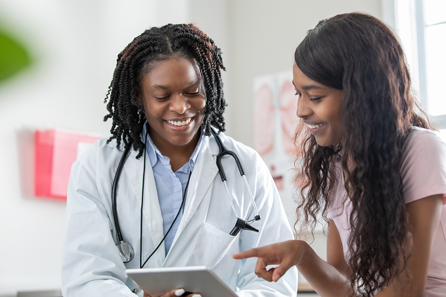 Woman talking with doctor