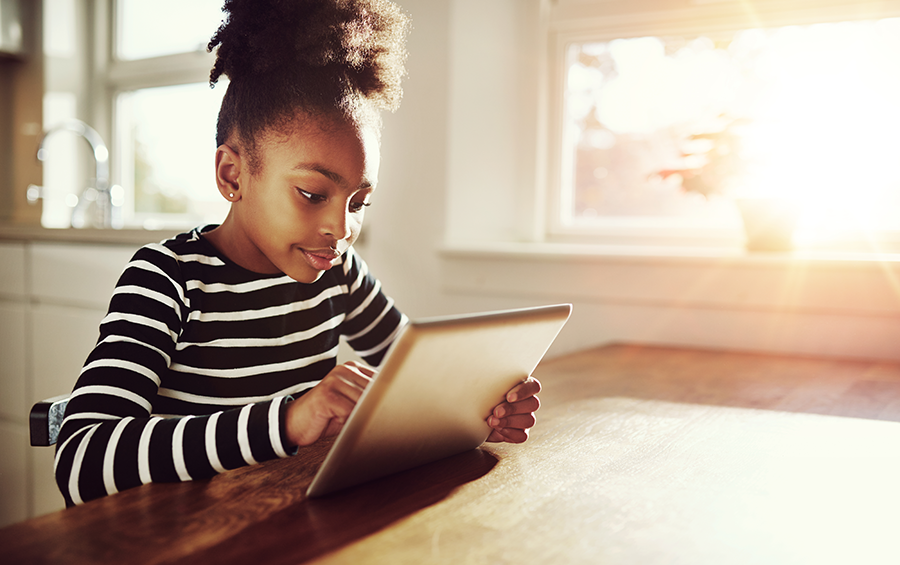 Young girl using tablet.