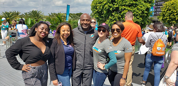 OJ McDuffie, a former wide receiver with the Miami Dolphins, poses with the Ambetter from Sunshine Health team at the DCC 5K on Feb. 29