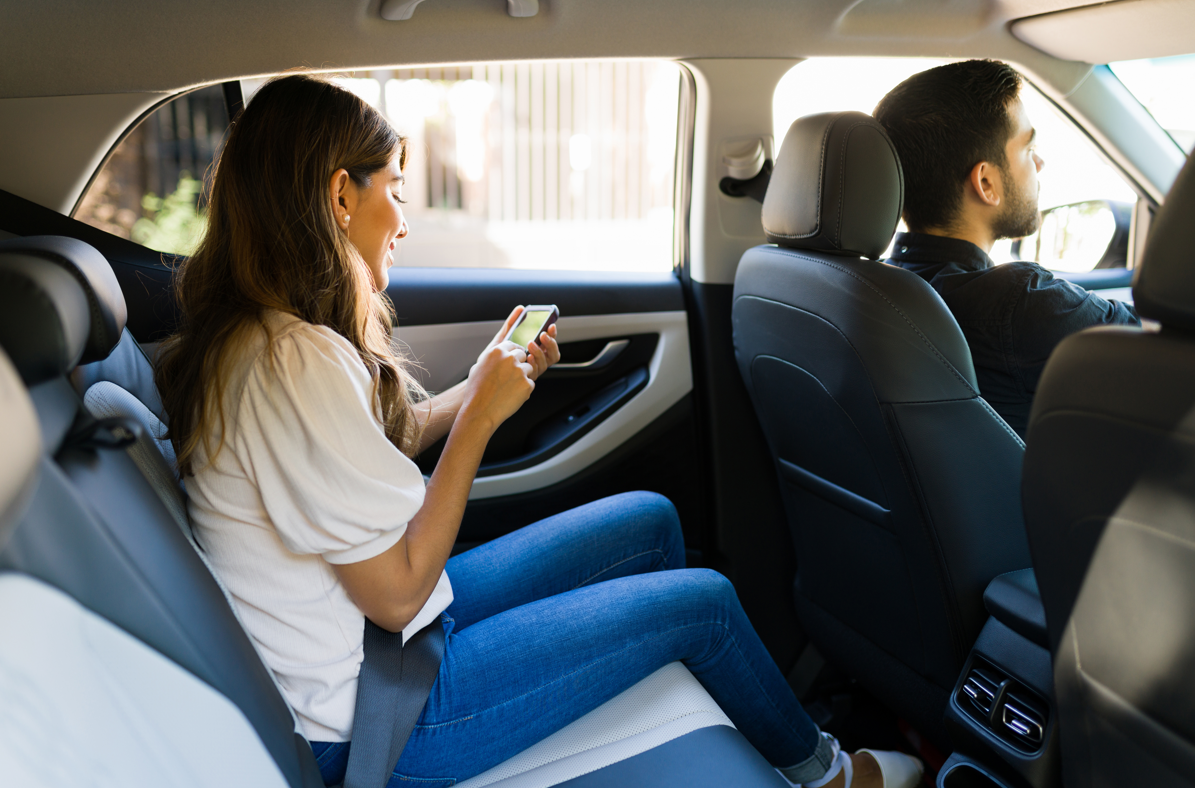 Woman getting ride in car