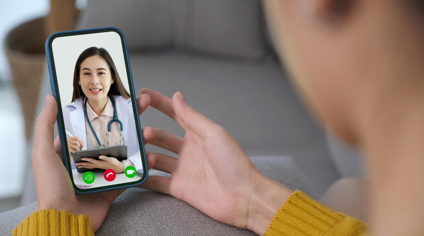 Doctor speaking with patient via telehealth on smart phone