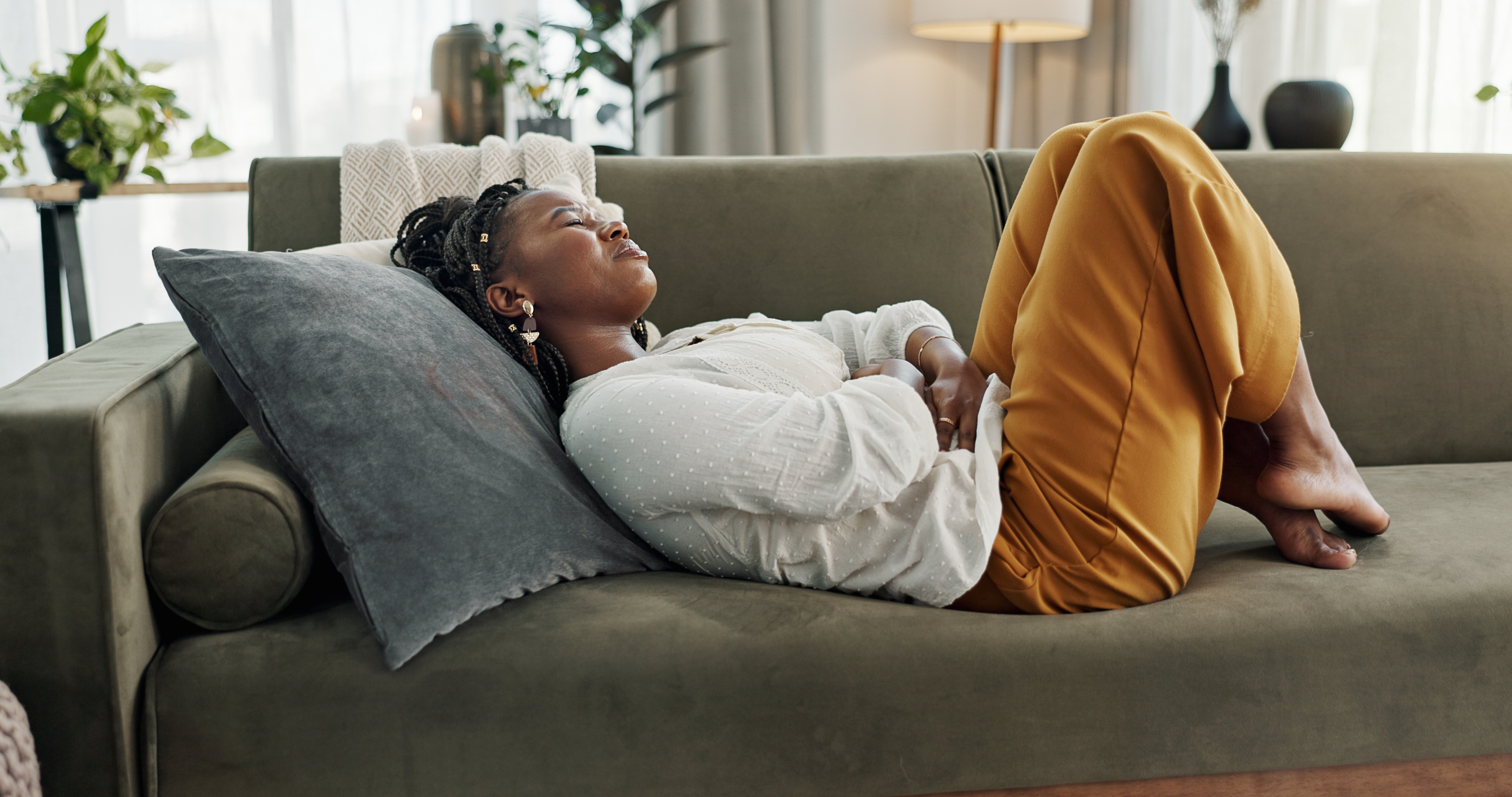 Woman resting on couch.