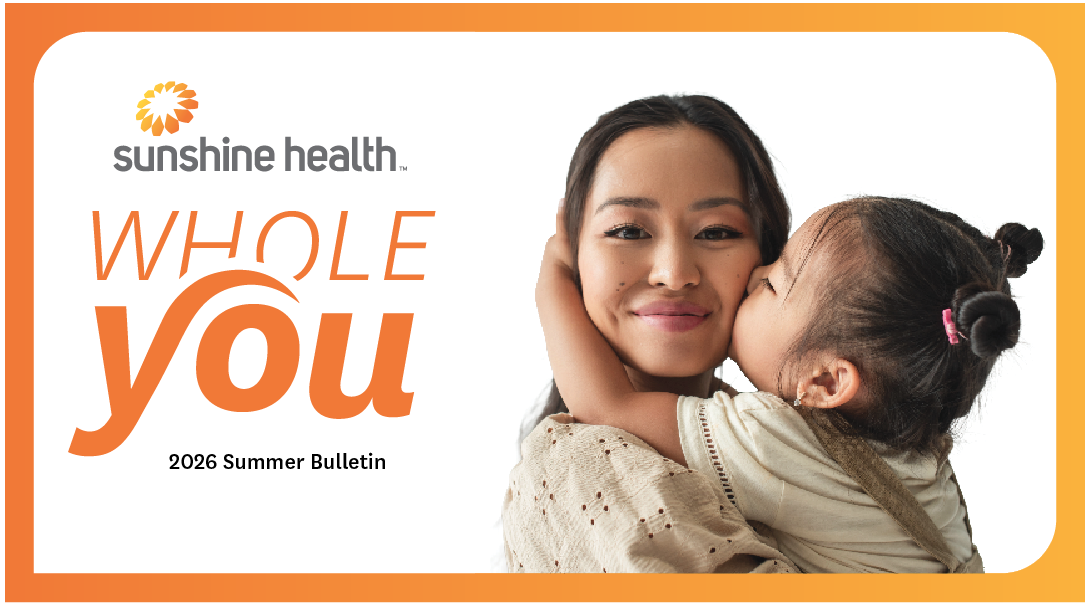 Mom hugging young girl. Sunshine Health Whole You Summer 2026 Bulletin